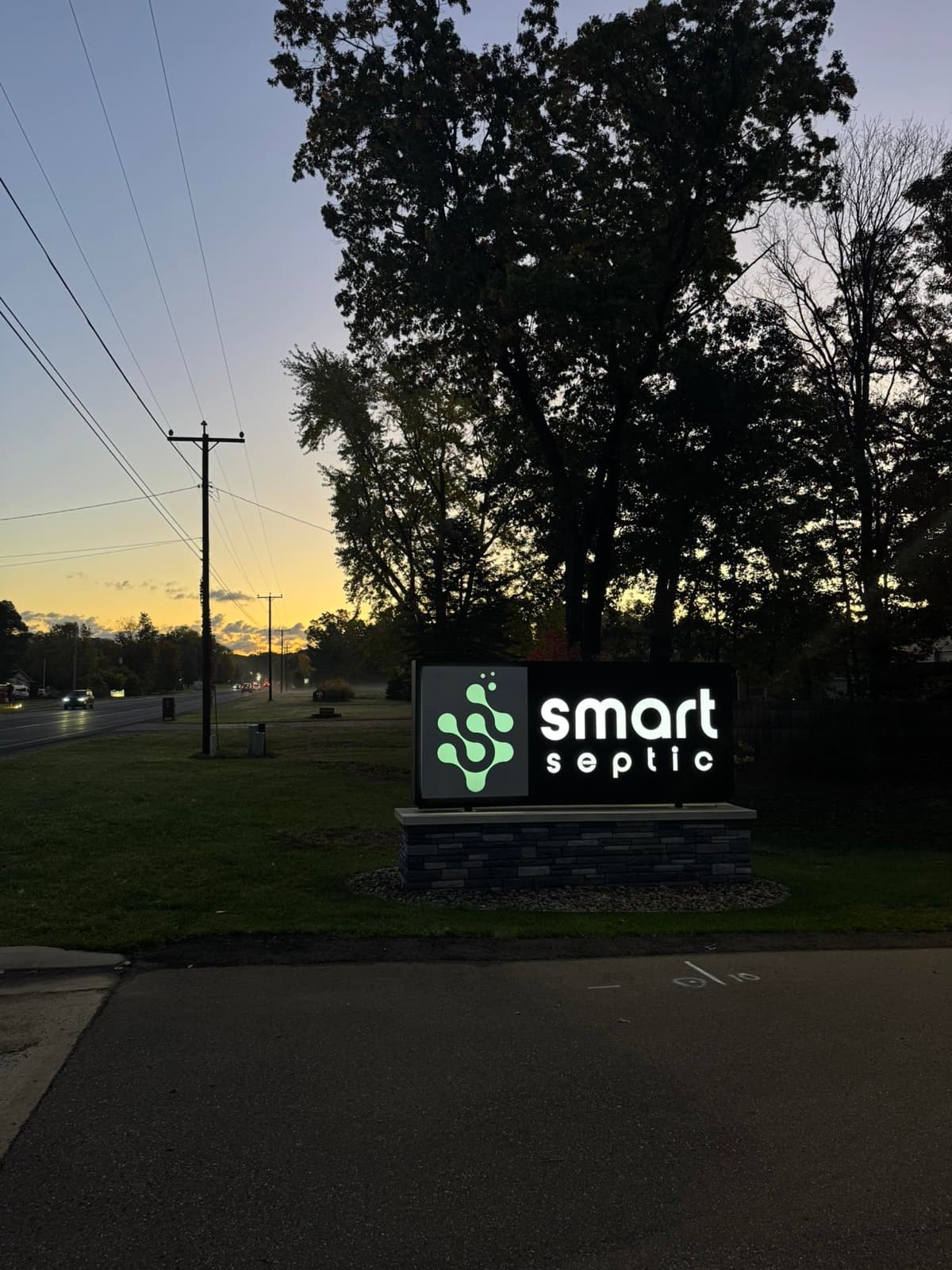 Illuminated Smart Septic sign on Red Arrow Hwy at dusk